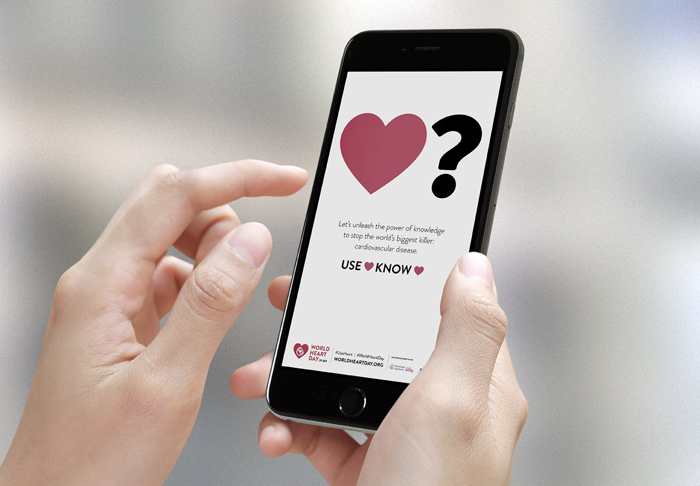 Apple iPhone showing a World Heart Day 2023 campaign banner
