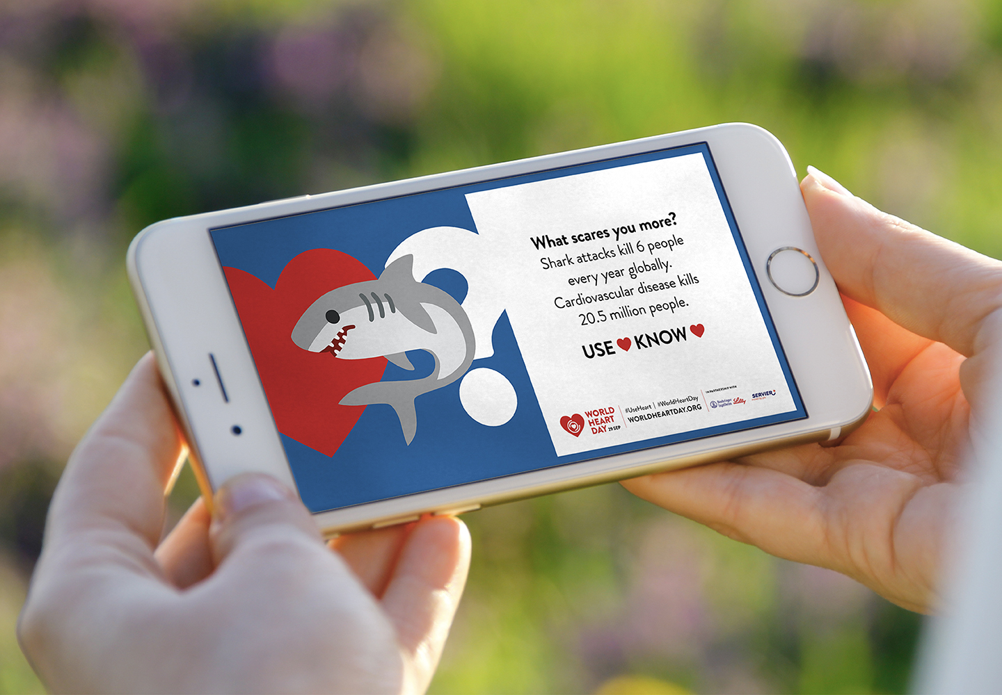 Apple iPhone showing a World Heart Day 2023 campaign banner
