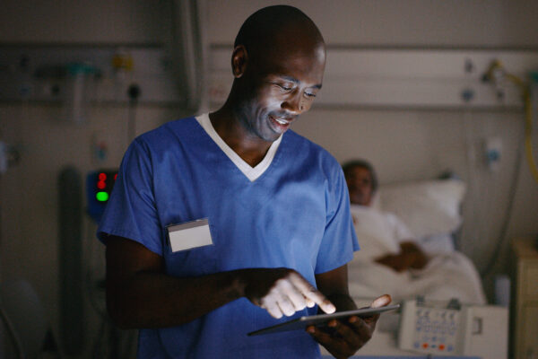 Shot of a medical practitioner using a digital tablet in a hospital ward