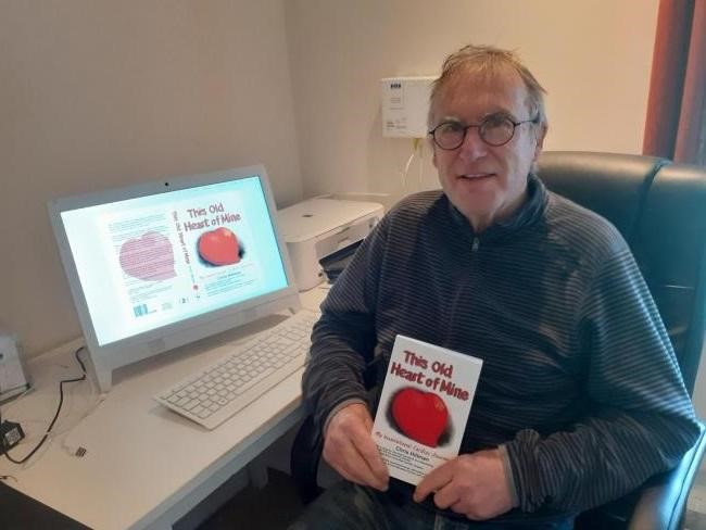 Chris Hillman with a book titled This Old Heart of Mine