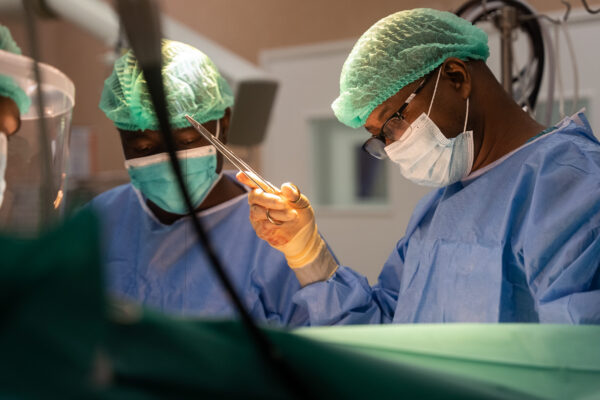 A surgeon performing an operation in an operating theatre