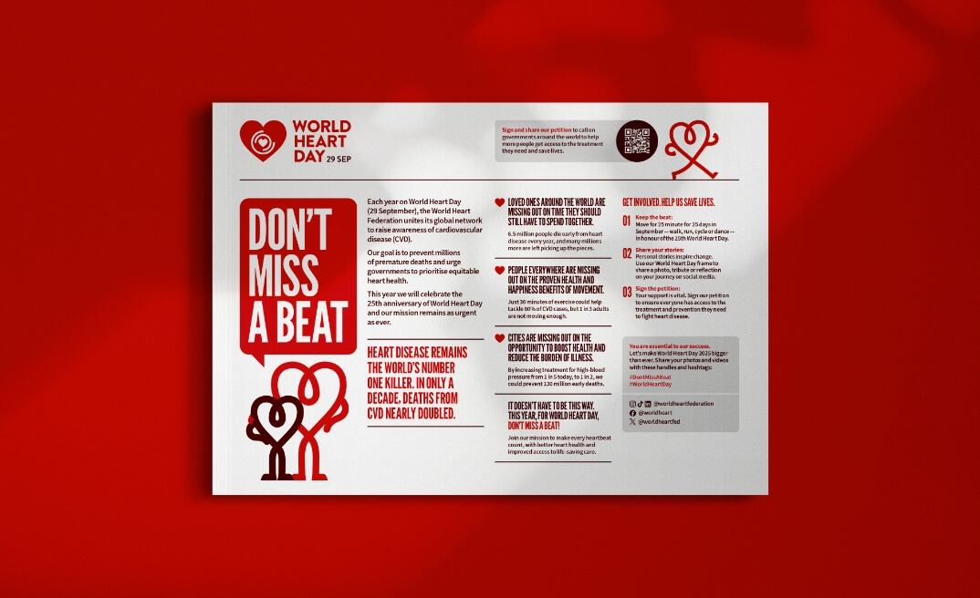 Mockup of a World Heart Day factsheet spread, showing textual content and graphics on a red and white design layout.