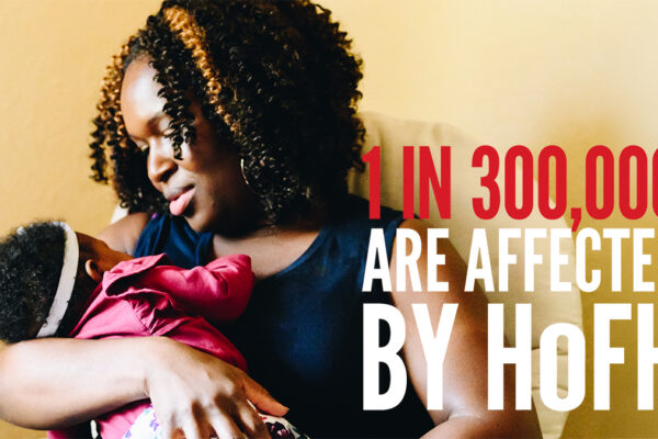 New mother and infant baby daughter in daily life at home