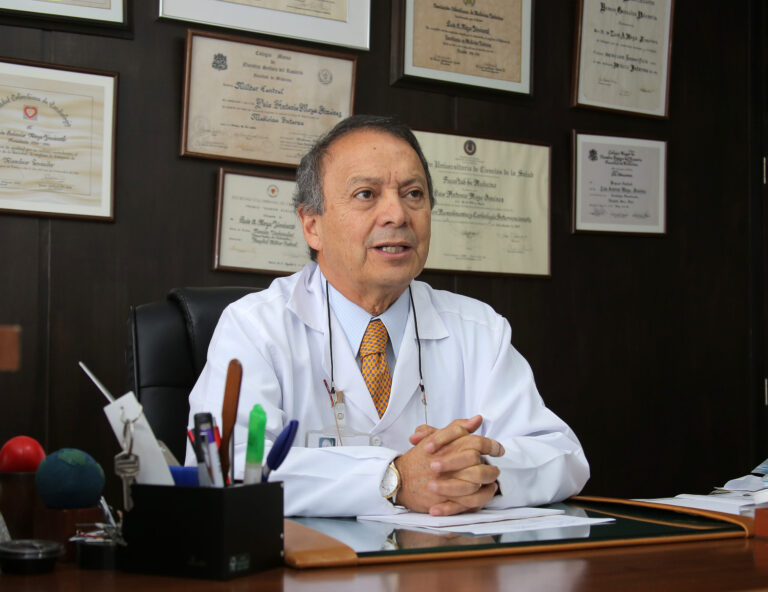 image of Dr Luis Moya Jiménez while sat at his desk