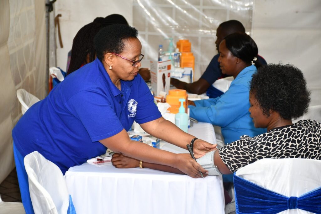 A healthcare professional performing a blood pressure test on a patient