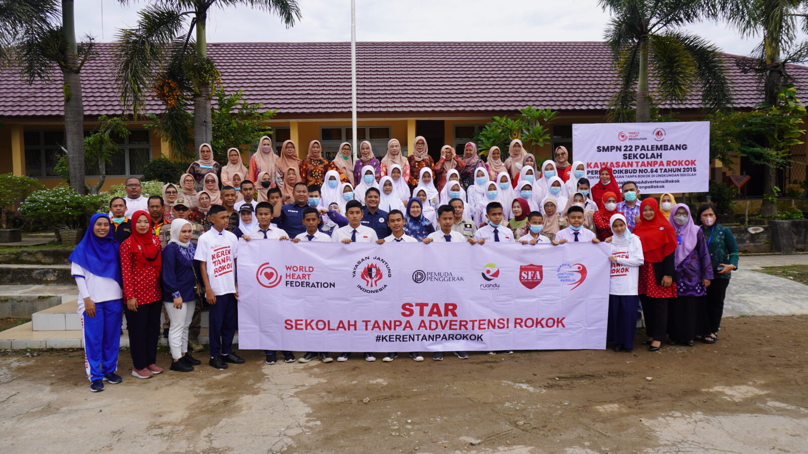 a group from the Indonesian Heart Federation are holding a banner advocating their support