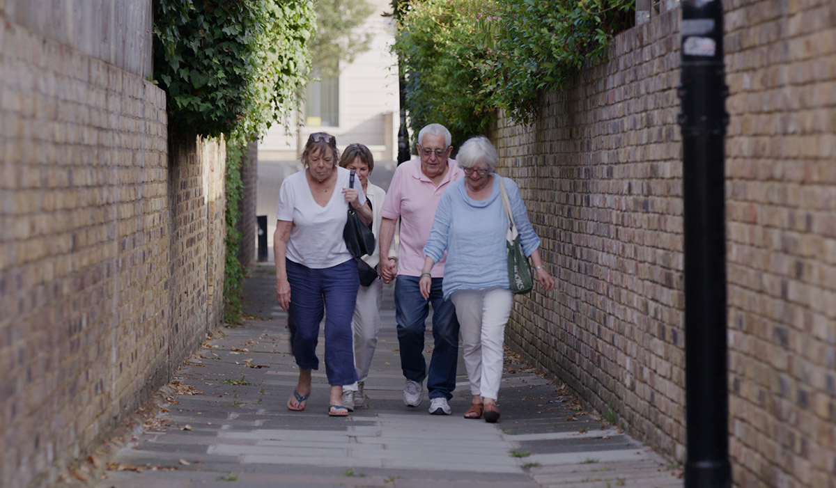 People walking down an alleyway. Sockwave Day