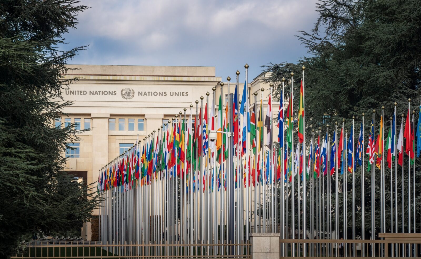 Geneva, Switzerland - December 03, 2019: Palace of Nations and Country flags - United Nations Office - Geneva, Switzerland