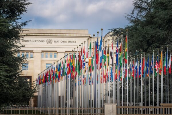 Geneva, Switzerland - December 03, 2019: Palace of Nations and Country flags - United Nations Office - Geneva, Switzerland