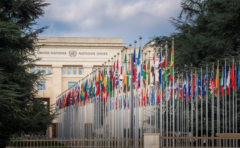 Geneva, Switzerland - December 03, 2019: Palace of Nations and Country flags - United Nations Office - Geneva, Switzerland