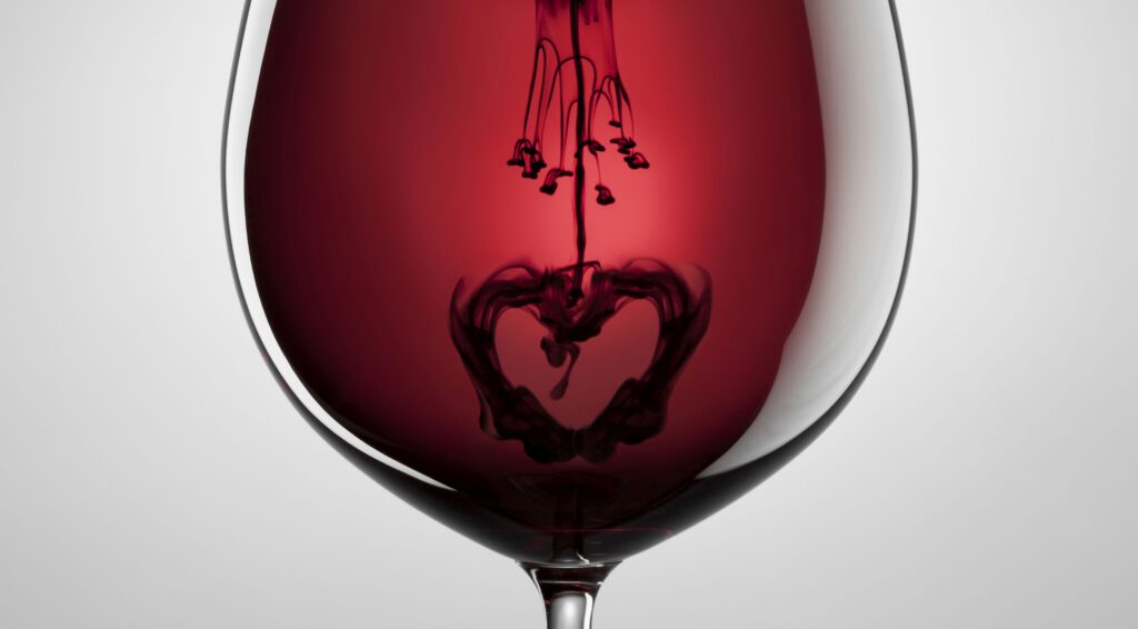 Wine glass, red wine, black ink and heart. Abstract love art
