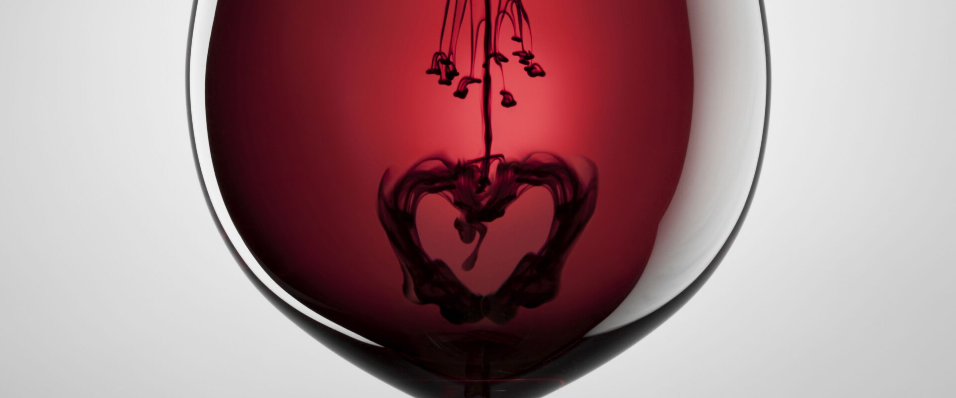 Wine glass, red wine, black ink and heart. Abstract love art