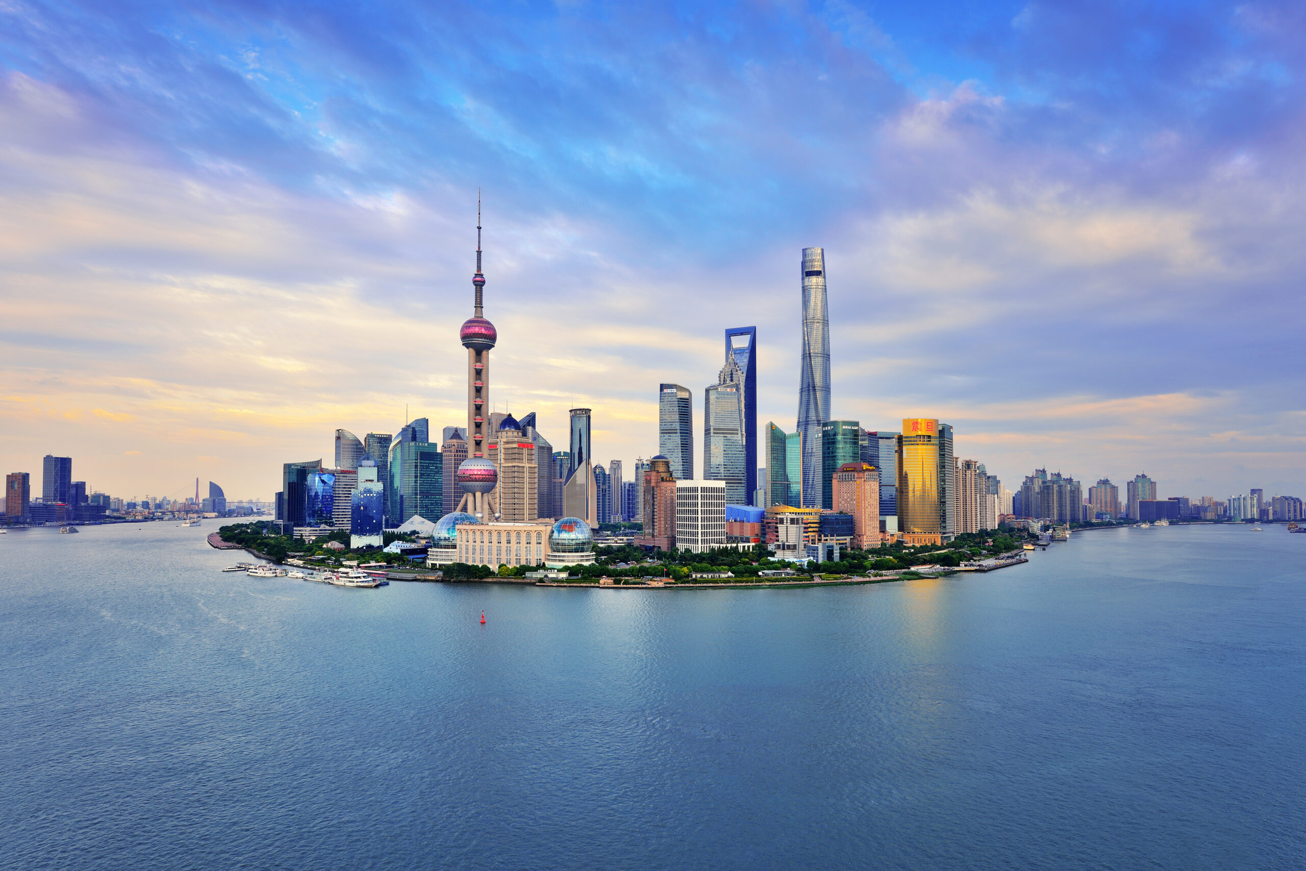 Shanghai skyline panoramic in the dramatic sky at sunset.
