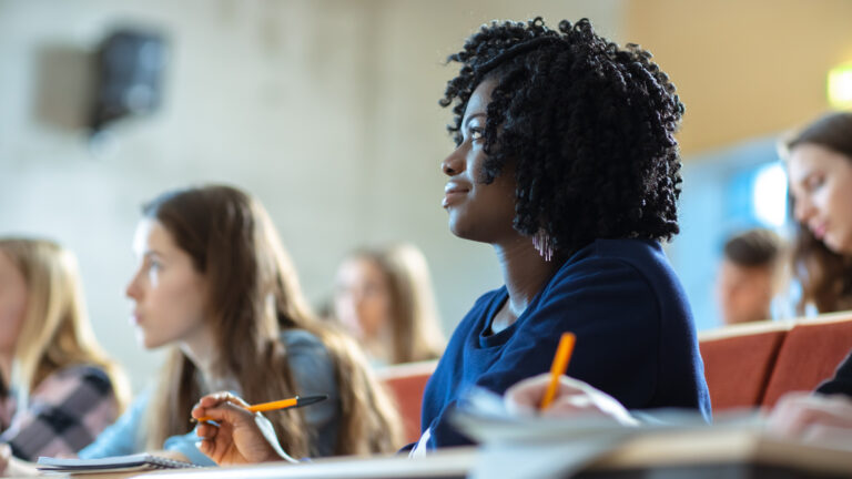 A young student in a lecture theatre