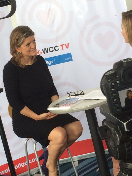 Interviewer from WCC TV speaking with a woman