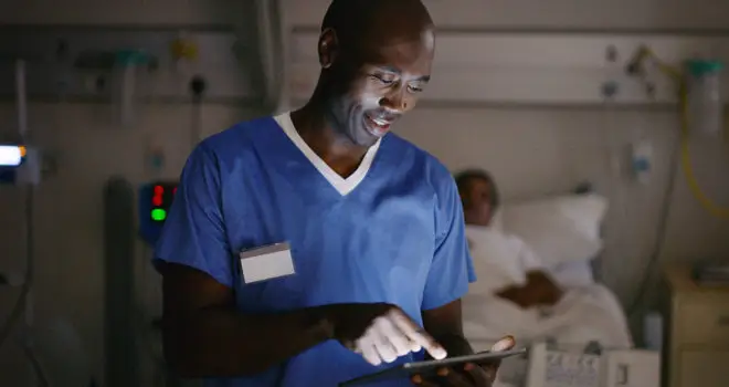 Shot of a medical practitioner using a digital tablet in a hospital ward