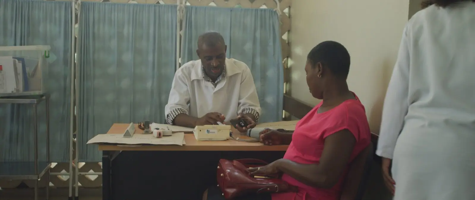An image of a doctor and a patient