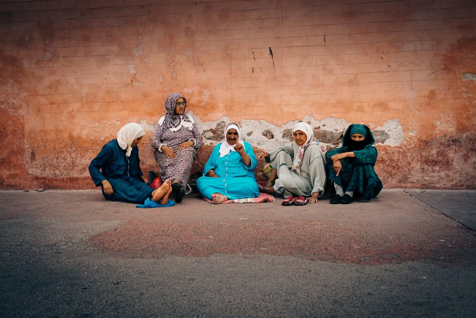 senior women sat on the floor outdoors