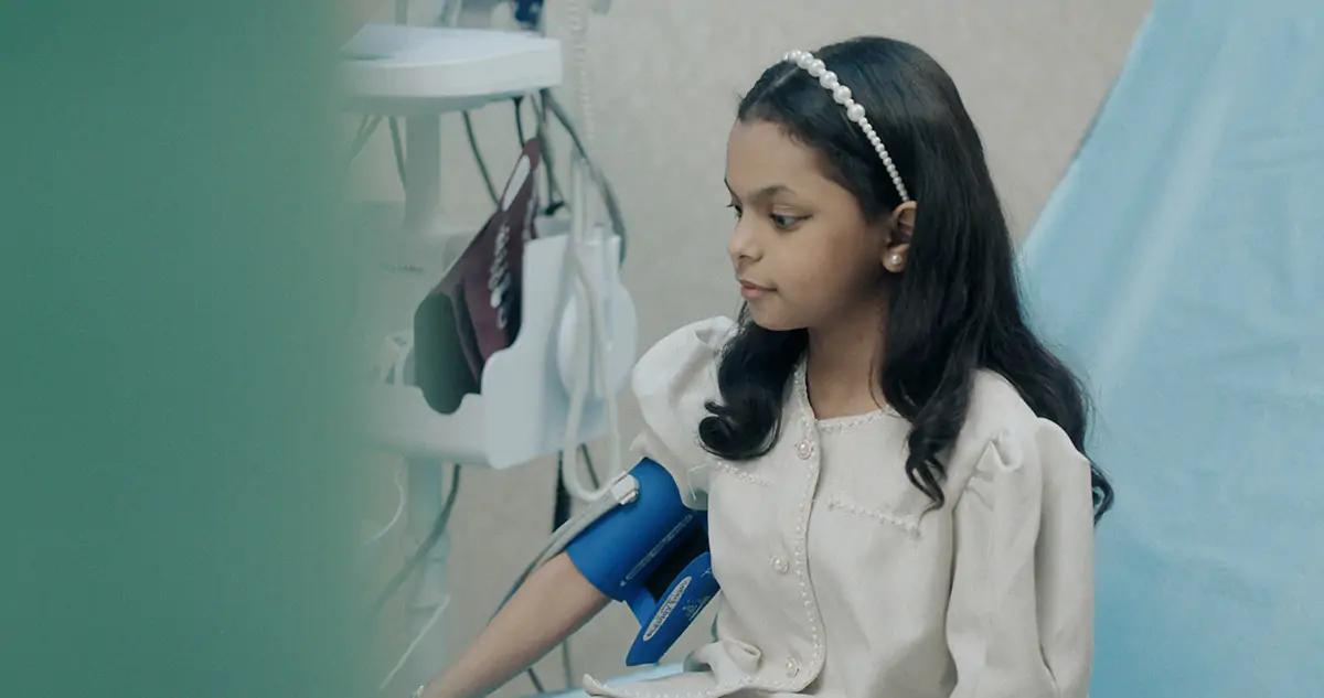 A young girls having her blood pressure taken