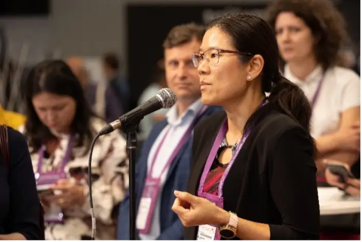 A woman speaking at WCC