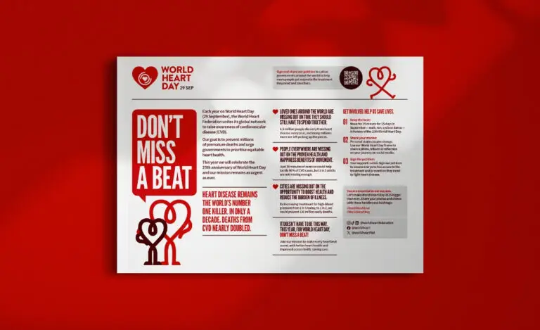 Mockup of a World Heart Day factsheet spread, showing textual content and graphics on a red and white design layout.