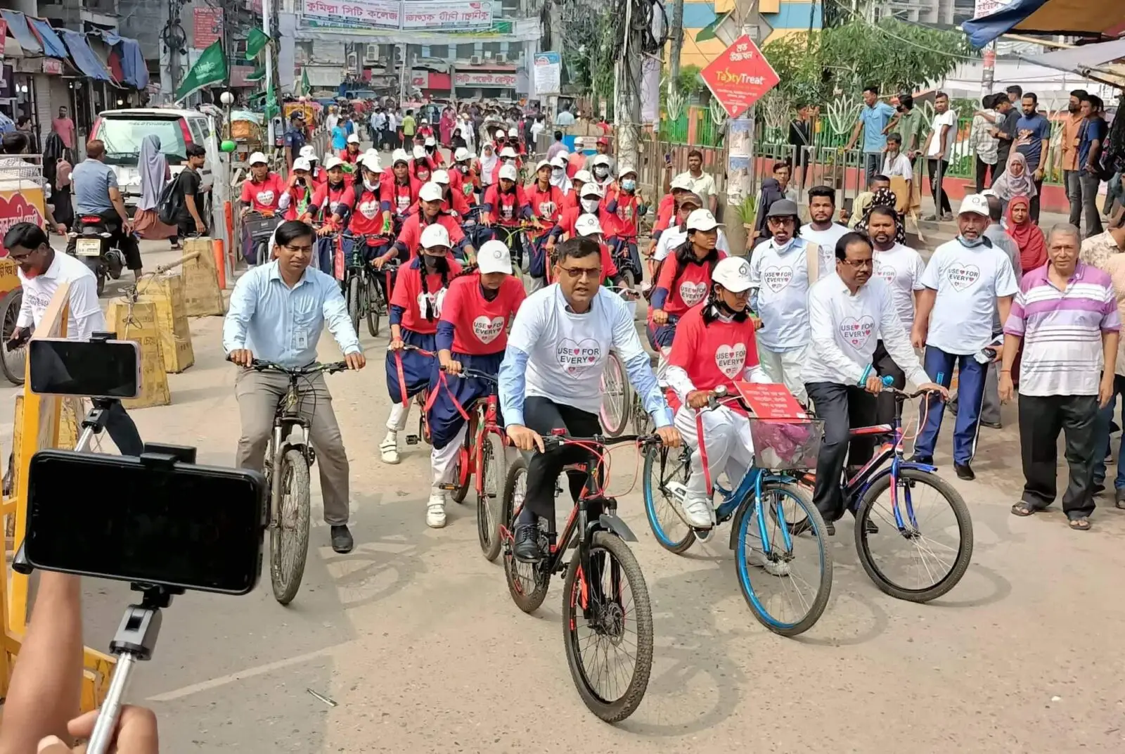 A group of heart care foundation Comilla advocates cycling through streets
