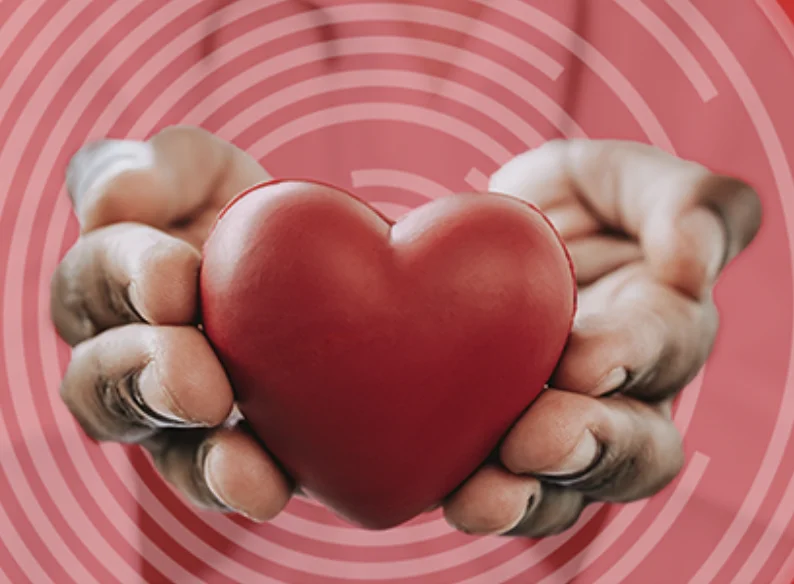 A heart held in two hands