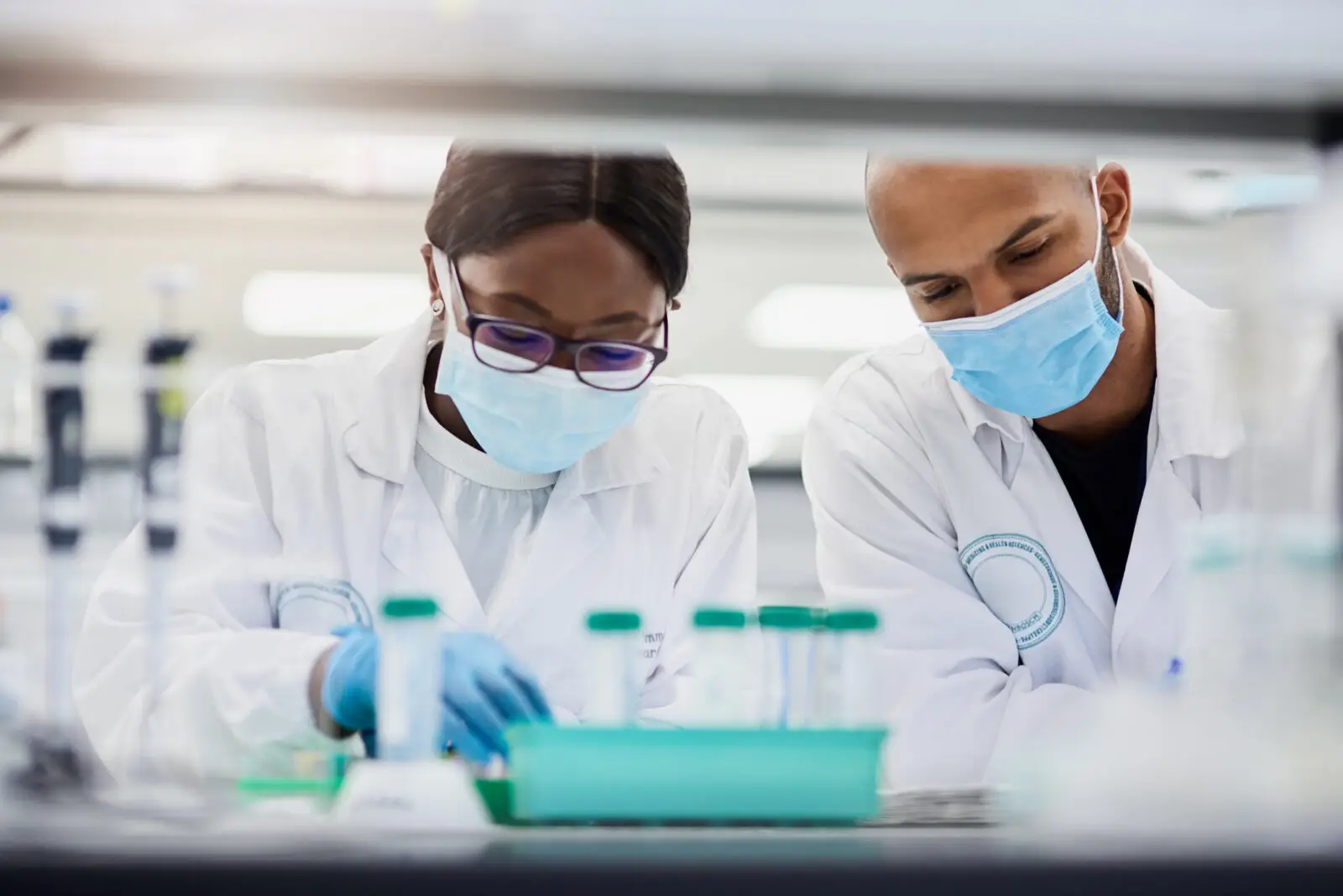 Shot of two young scientists conducting medical research in a laboratory