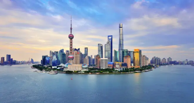 Shanghai skyline panoramic in the dramatic sky at sunset.