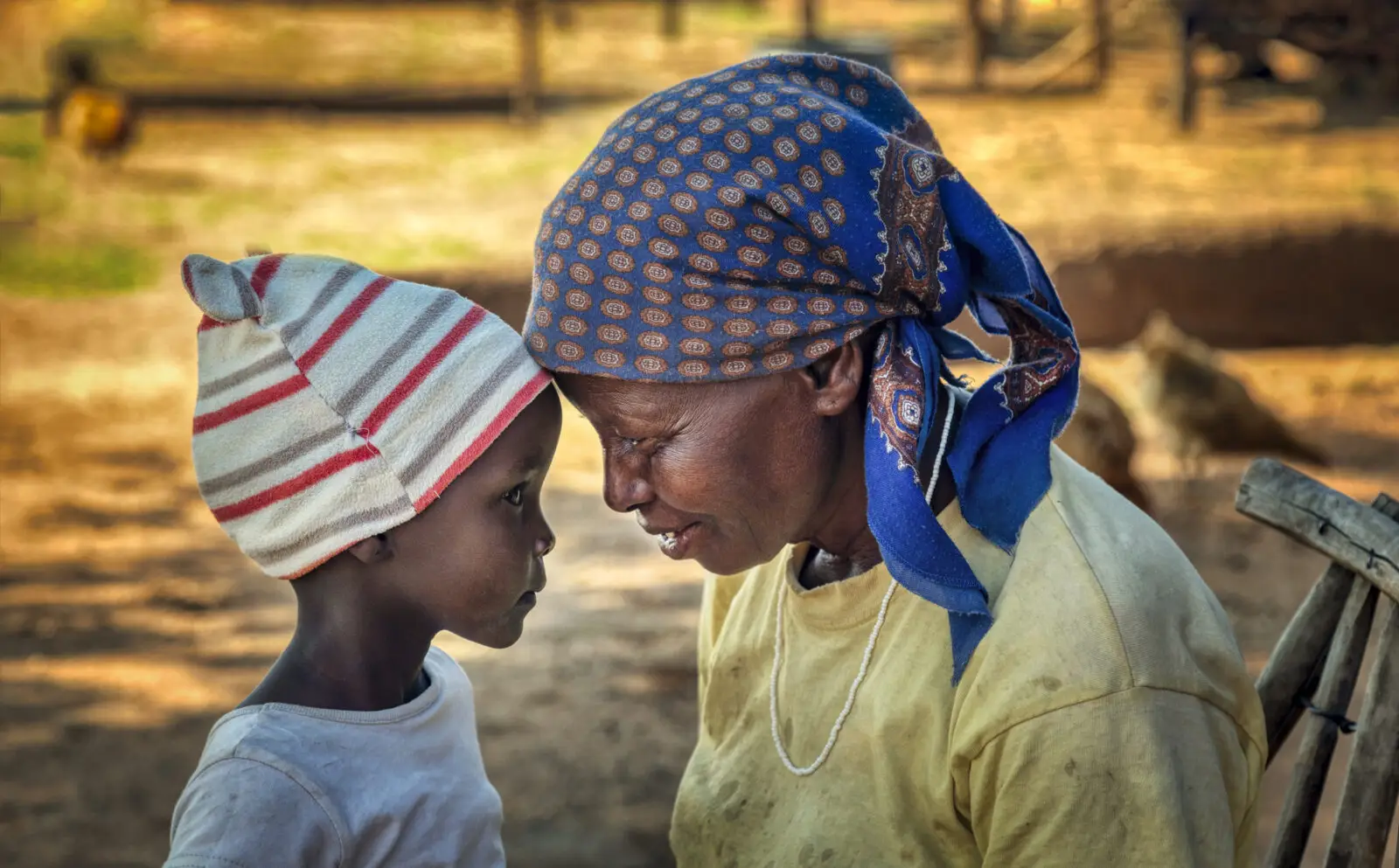 Loving African granny together with her granddaughter in a village in Botswana