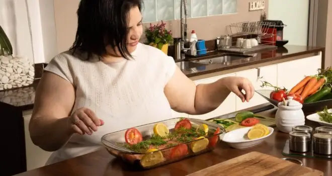 woman cooking a healthy meal in the kitchen